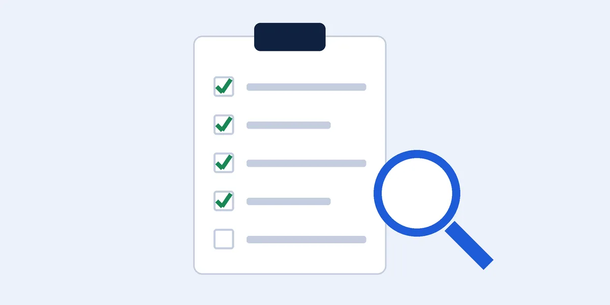 SEO audit services: a clipboard checklist with ticks beside a magnifying glass
